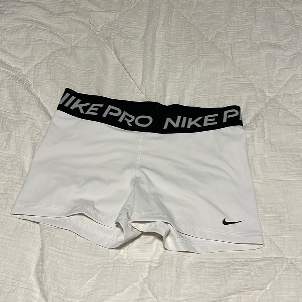 Women’s white Nike pros